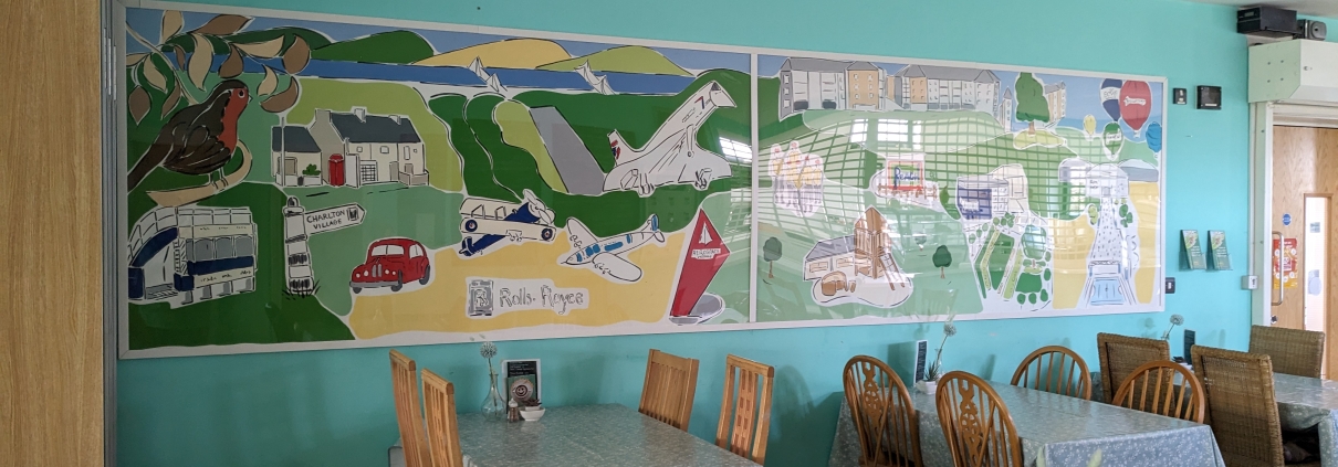 Mural representing Patchway and Charlton Hayes past, present and future on the wall at Coniston Cafe in Coniston Community Centre.